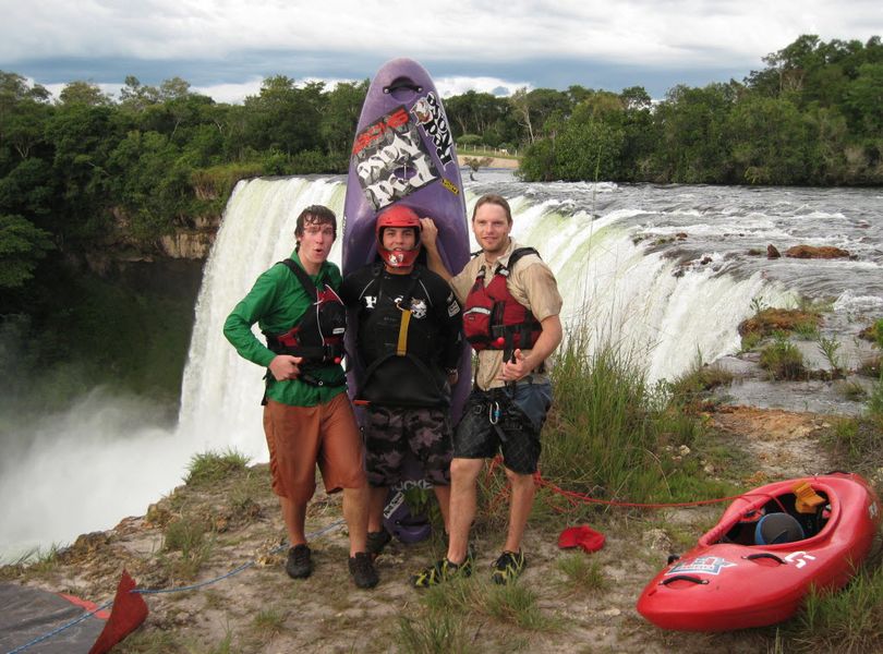 In this March 4, 2009 photo provided by Chris Korbulic, from left, Chris Korbulic, Pedro Oliva, and Ben Stookesberry gather for a photo in front of Salto Belo falls on Rio Sacre, in Campos Novos, in central Brazil. Rescuers say that a South African man leading Americans, Ben Stookesberry and Chris Korbulic, on a whitewater expedition in Central Africa was attacked by a crocodile and pulled from his kayak. The body of Hendri Coetzee has not been recovered following the Tuesday morning, Dec. 7, 2010 attack on the Lukuga River. Ciaran Donnelly, International Rescue Committee's regional director in Congo, said Thursday, Dec. 9, that his organization had evacuated the two Americans to a nearby town after they paddled to safety. The three men were part of a mission to document unexplored whitewater in the region. (AP Photo/Courtesy Chris Korbulic, File) (Chris Korbulic)