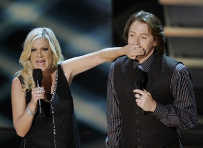 
Clay Aiken is shushed by Tori Spelling at the American Music Awards on Tuesday.
 (Associated Press / The Spokesman-Review)