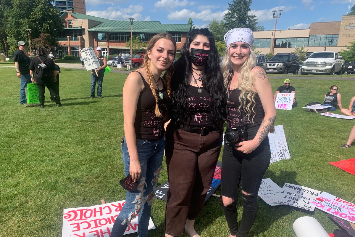 The young women who put together the protest for Roe on Sunday in Nothern Idaho. Lili Vae'ena (to the left), Ella Greer (middle), and Lily Barnes (to the right).   (Jase Picanso/Spokesman Review)