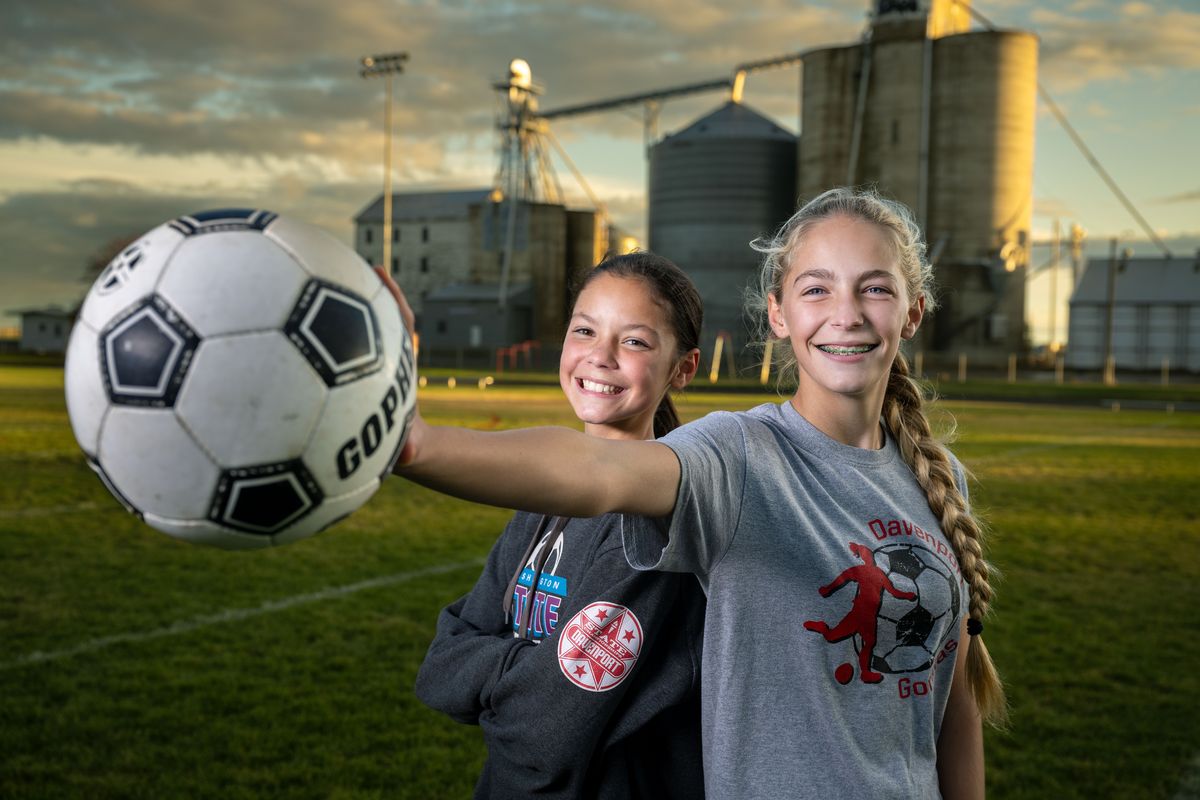 Sisters Charlotte, left, and Glenna Soliday run cross country and play soccer in the same season for Davenport High School.  (COLIN MULVANY)