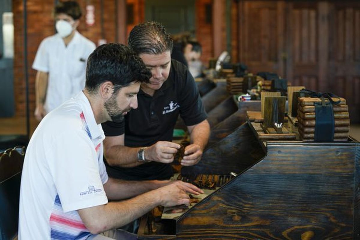 Daniel Seddiqui, left, makes cigars in Tampa, Florida.  (Courtesy Daniel Seddiqui)