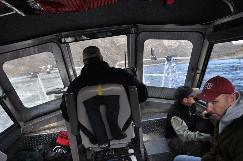 Fishing guide Pete Paolino negotiates his jet boat through a rough rapid on the Snake River near the Washington-Oregon border as he shuttles his anglers to another steelhead fishing hole. (Rich Landers / The Spokesman-Review)