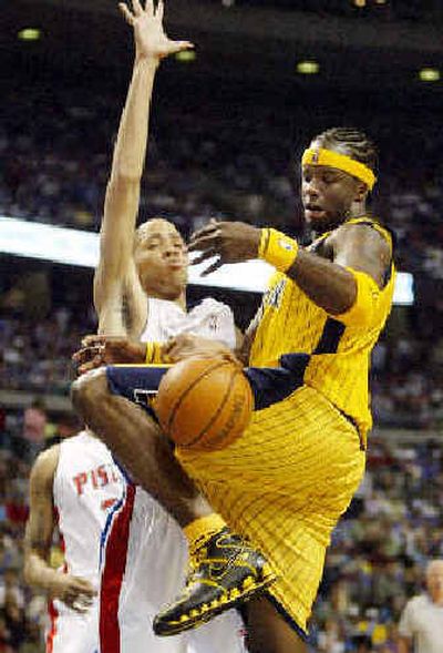 
Indiana's Jermaine O'Neal loses control of the ball while defended by Detroit's Tayshaun Prince in the first quarter of their Eastern Conference semifinal game Monday.
 (Associated Press / The Spokesman-Review)