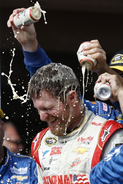 Dale Earnhardt Jr. is doused by crew members after his third win of the season. (Associated Press)