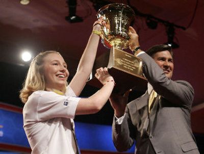 
Katharine Close, of Spring Lake, N.J., holds the trophy she won at the 2006 National Spelling Bee with Ken Lowe, CEO of E.W. Scripps Co., on Thursday in Washington. 
 (Associated Press / The Spokesman-Review)