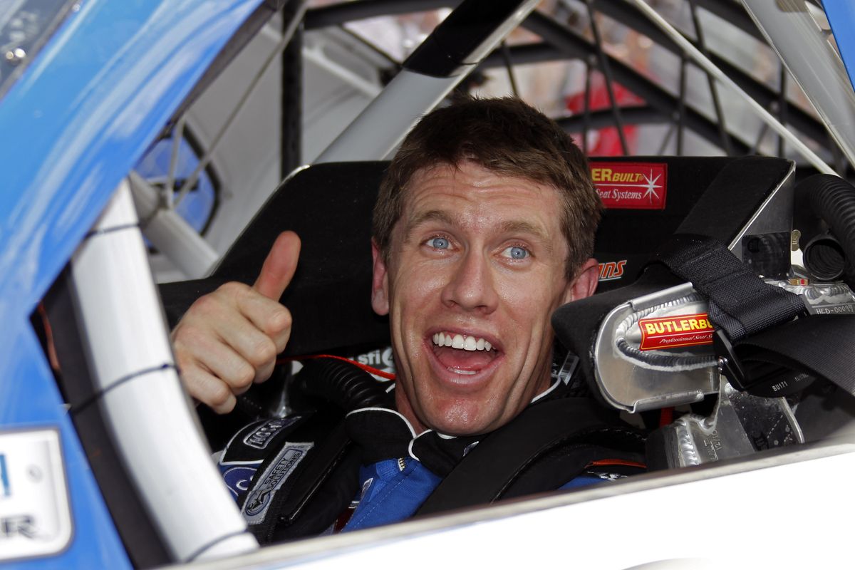 Carl Edwards gives a thumbs-up in his car after his qualifying run on Sunday for the NASCAR Daytona 500 auto race. (Associated Press)