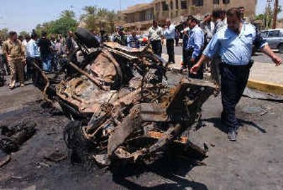 Iraqi police inspect the wreckage after a car bomb exploded in Baghdad on Wednesday, killing four people and injuring dozens, according to police. Iraqi police inspect the wreckage after a car bomb exploded in Baghdad on Wednesday, killing four people and injuring dozens, according to police.
(Associated PressAssociated Press / The Spokesman-Review)