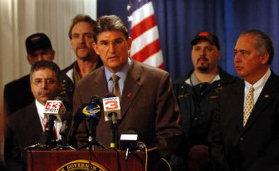 
West Virginia Gov. Joe Manchin, center, holds a news conference Wednesday in Charleston, where he called for all coal companies in West Virginia to halt production for safety inspections. 
 (Associated Press / The Spokesman-Review)