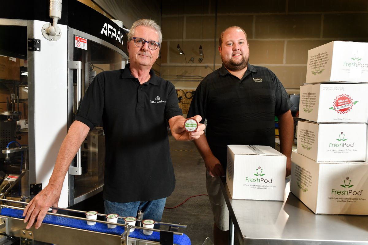 Post Falls-based Coffee Crafters’ Ken Lathrop and Bryce Bull show one of the company’s FreshPods. Coffee Crafters launched FreshPods via its website last week.  (Tyler Tjomsland/THE SPOKESMAN-REVIEW)