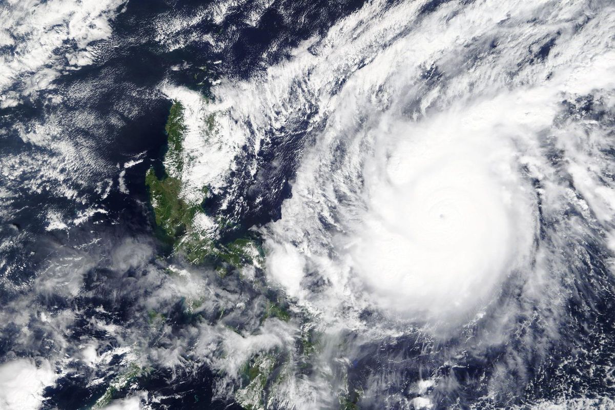 This Saturday, Oct. 31, 2020, satellite image released by NASA Worldview, Earth Observing System Data and Information System (EOSDIS) shows a typhoon locally known as Goni moving around the Philippines. The super typhoon slammed into the eastern Philippines with “catastrophic violent winds” early Sunday and about a million people have been evacuated in its projected path, including in the capital where the main international airport has been ordered closed, officials said.  (HOGP)