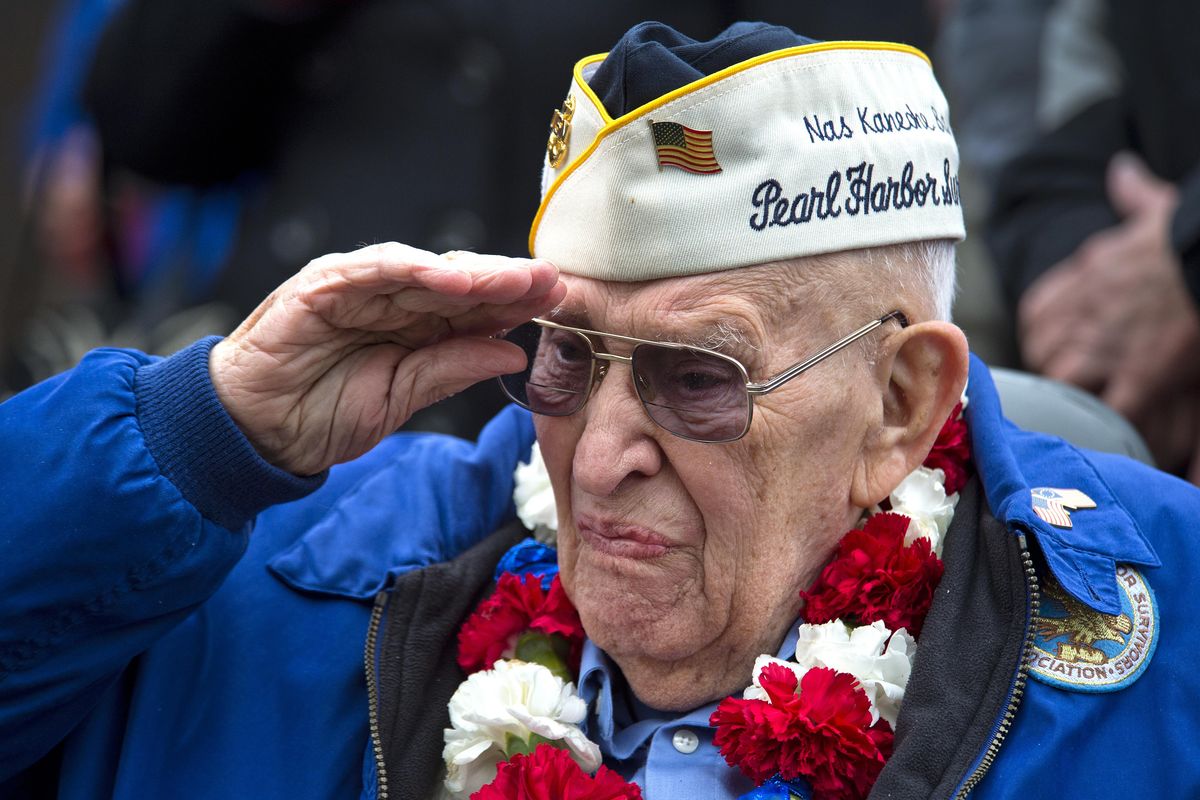 Pearl Harbor Survivor Charlie Boyer, in 2014, salutes the fallen during a ceremony at the Spokane Veterans Memorial Arena to commemorate the 73rd anniversary of the attack that began America’s involvement into World War II. (Dan Pelle / The Spokesman-Review)