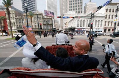 
New Orleans Mayor Ray Nagin waves as his carriage approaches Canal Street on Thursday. Nagin was sworn in for a second four-year term on the same day that the Atlantic hurricane season began and the Army Corps of Engineers released a report claiming responsibility for the flooding of the city during Hurricane Katrina. 
 (Associated Press / The Spokesman-Review)