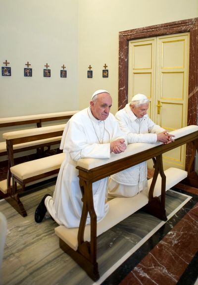 Pope Francis, left, and Pope emeritus Benedict XVI pray together Saturday in Castel Gandolfo, Italy. (Associated Press)