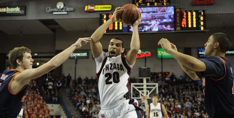 Gonzaga's Elias Harris rips a rebound away from Pepperdine. (Dan Pelle / The Spokesman-Review)