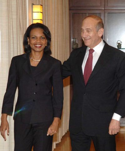 
Israeli Prime Minister Ehud Olmert, right, greets U.S. Secretary of State Condoleezza Rice in Jerusalem on Saturday. 
 (The Spokesman-Review)
