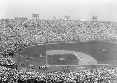 
This view shows the crowd of 78,682 at the L.A. Memorial Coliseum before the Dodgers and Giants played on opening day in 1958. Associated Press
 (Associated Press / The Spokesman-Review)