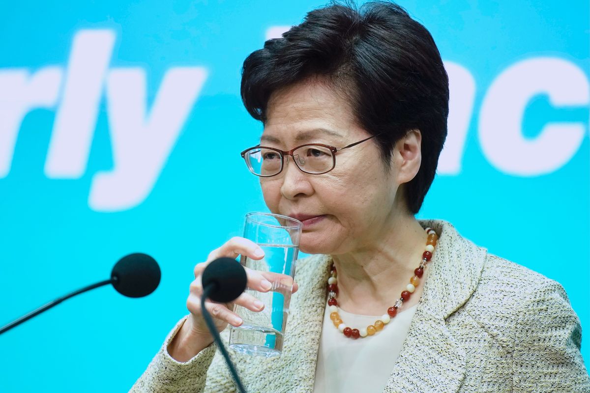 Hong Kong Chief Executive Carrie Lam drinks water during a press conference in Hong Kong, Tuesday, June 15, 2021. Lam said that her government is “highly concerned” about the situation at a nearby nuclear power plant in mainland China, following media reports that the plant could be experiencing a leak. (Vincent Yu)