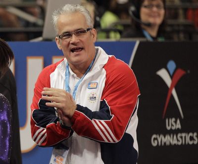 FILE - In this March 3, 2012, file photo, gymnastics coach John Geddert is seen at the American Cup gymnastics meet at Madison Square Garden in New York. Prosecutors in Michigan filed charges Thursday, Feb. 25, 2021, against Geddert, a former U.S. Olympics gymnastics coach with ties to disgraced sports doctor Larry Nassar. Geddert was head coach of the 2012 U.S. women's Olympic gymnastics team, which won a gold medal.  (Kathy Willens)