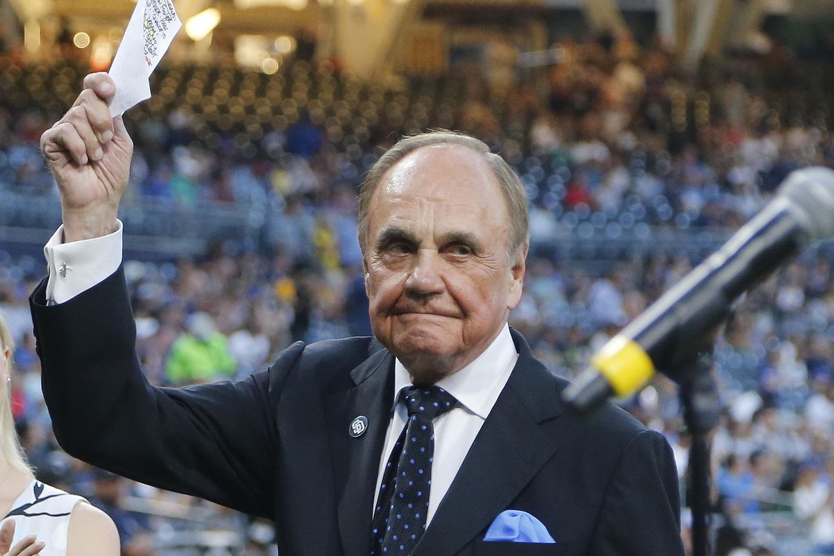 In this Sept. 29, 2016, file photo, San Diego Padres broadcaster Dick Enberg waves to crowd at a retirement ceremony prior to the Padres