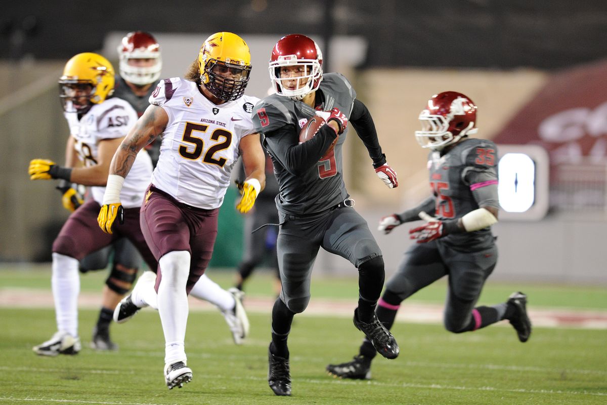 Cougars receiver Gabe Marks scores on a 34-yard pass from Connor Halliday to make the score 21-7 in the second quarter. (Tyler Tjomsland)