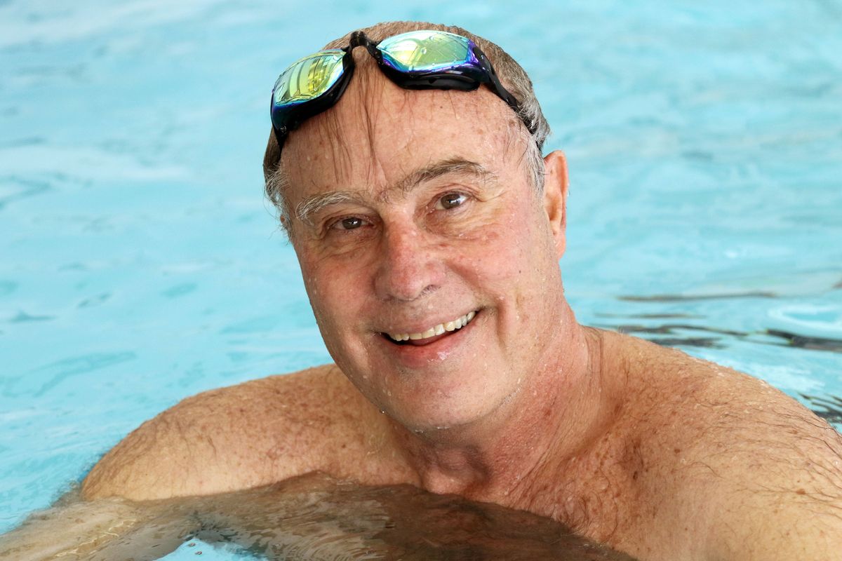 Pullman orthopedic surgeon Doug Hiller takes a break while swimming on Monday, July 27, 2021, at the WSU Student Recreation Center in Pullman, Wash. Hiller will be leaving Aug. 22 for the Paralympics in Tokyo, Japan, where he will be the head doctor for the triathlon. (Geoff Crimmins For The Spokesman-Review)