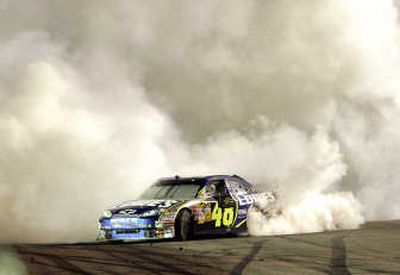 
Jimmie Johnson does a burnout after winning the NASCAR Subway Fresh Fit 500. Associated Press
 (Associated Press / The Spokesman-Review)