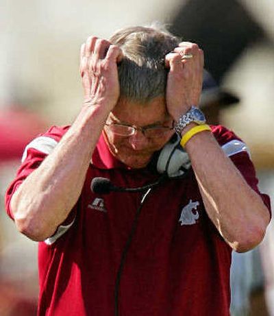 
It was day worth tearing out your hair for Washington State and its head coach, Bill Doba.
 (Associated Press / The Spokesman-Review)