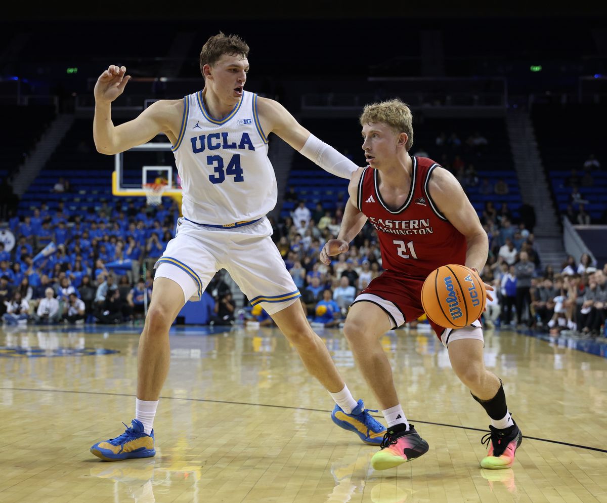 Eastern Washington guard Johnny Radford dribbles past UCLA defender Tyler Bilodeau on Nov. 3 in Los Angeles. (Courtesy of EWU Athletics)