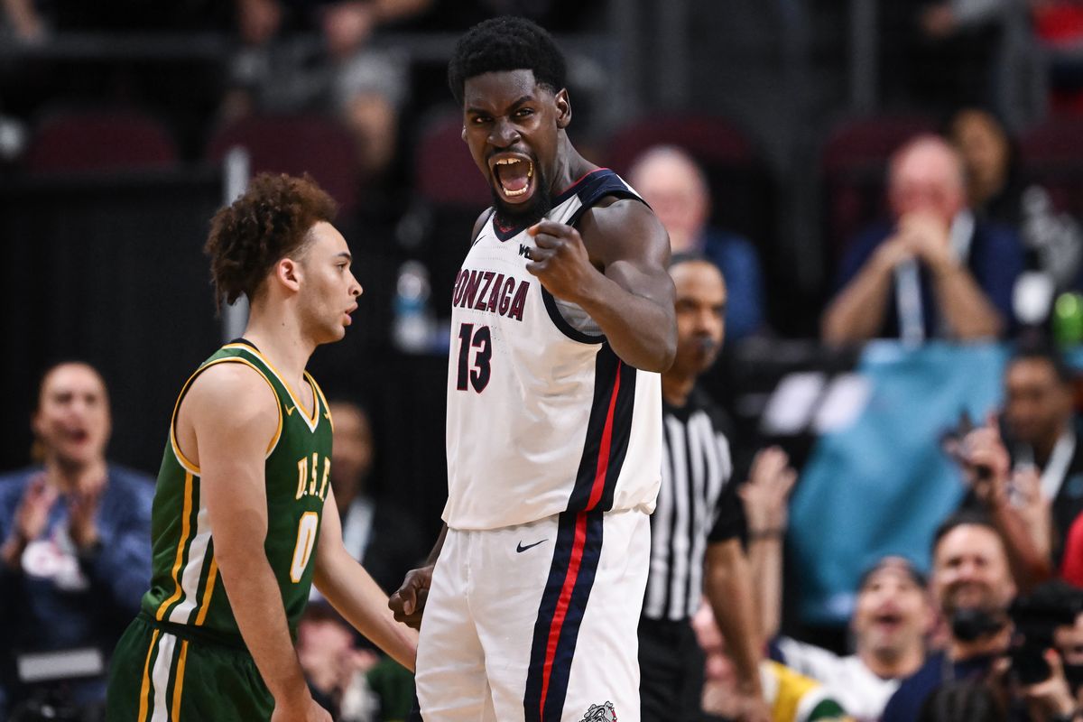 Gonzaga Bulldogs forward Graham Ike (13) celebrates after scoring against San Francisco as Dons guard Ryan Beasley (0) reacts during the second half of the WCC Tournament Semifinals on Monday, Mar. 10, 2025, at Orleans Arena in Las Vegas, Nev. Gonzaga won the game 85-76. (Tyler Tjomsland/The Spokesman-Review)