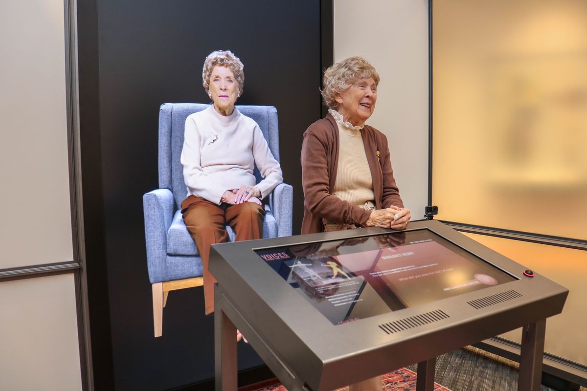Former USO dancer Margaret Kerry-Boeke, who sat for two days of interviewers and answered nearly 1,000 questions on camera, stands with her video image at the Voices From the Front exhibit at the National WWII Museum in New Orleans. MUST CREDIT: La'Shance Perry 