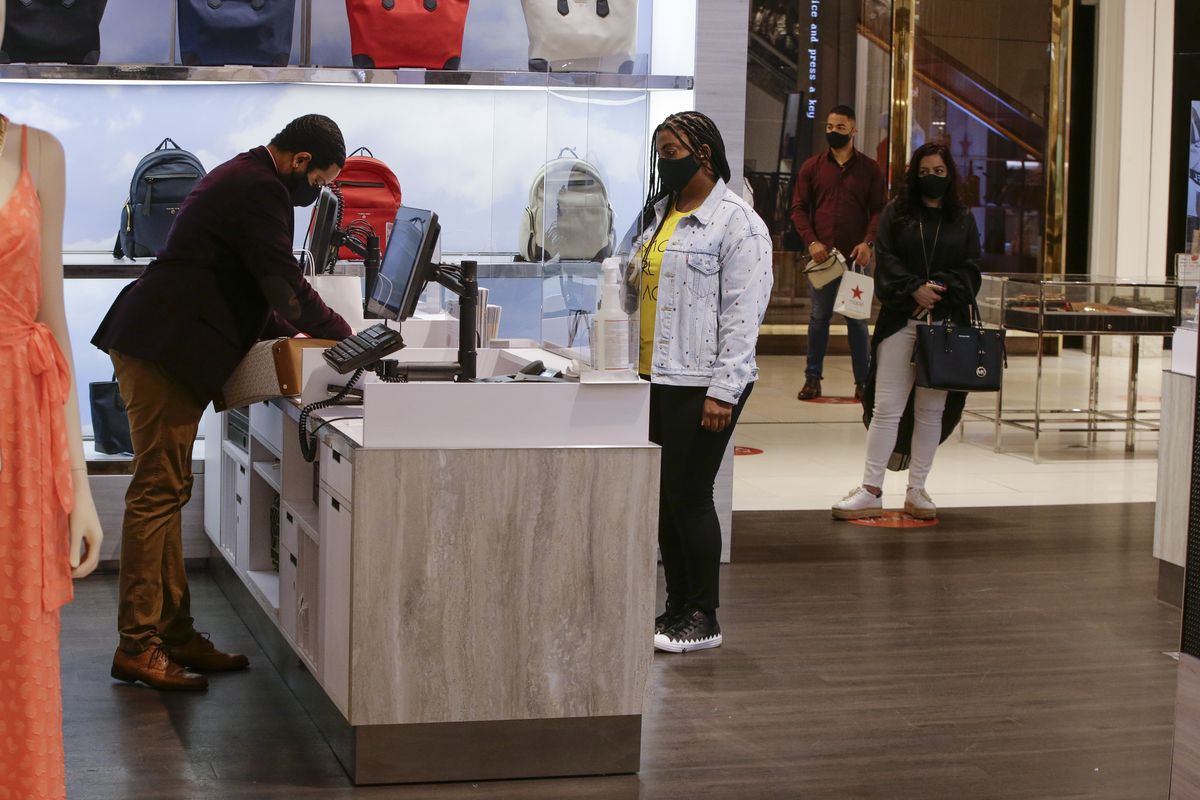 Workers test social distancing at the Macy