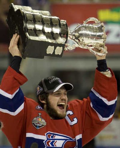 Spokane Chiefs captain Chris Bruton celebrates as he hoists the Memorial Cup after defeating the Kitchener Rangers.Associated Press
 (Associated Press / The Spokesman-Review)