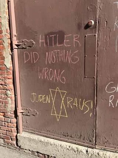 Graffiti praising Adolf Hitler was written on the back door of the Community Building in downtown Spokane on Friday, April 28, 2017. (Courtesy of Center for Justice)