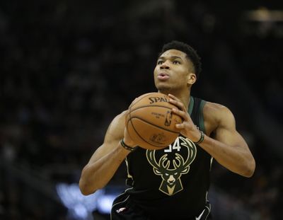 Milwaukee Bucks' Giannis Antetokounmpo shoots a free throw during Friday’s game against Atlanta. Milwaukee won 144-112. (Aaron Gash / Associated Press)