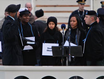 Inaugural stand-ins, from left: President-elect Barack Obama: Army Sgt. Derrick Brooks; Michelle Obama: Navy Yeoman 1st Class LaSean McCray; Malia Obama: Dominique Sewell; Sasha Obama: Gianna Justice Samora-Nixon; Chief Justice John Roberts: Army Sgt. Brian Picerno.  (Associated Press / The Spokesman-Review)