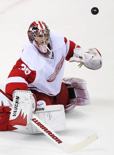 Detroit Red Wings goalie Jimmy Howard watches the puck during the first period against the San Jose Sharks. (Associated Press)