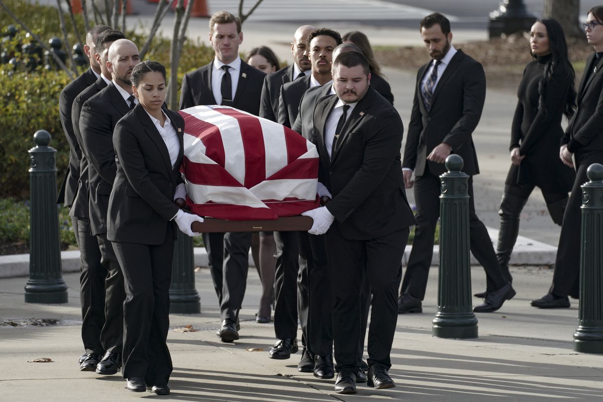 Sandra Day O'Connor's casket arrives Monday at the Supreme Court, where she was to lie in repose for public visitation.   (Bonnie Jo Mount/The Washington Post)