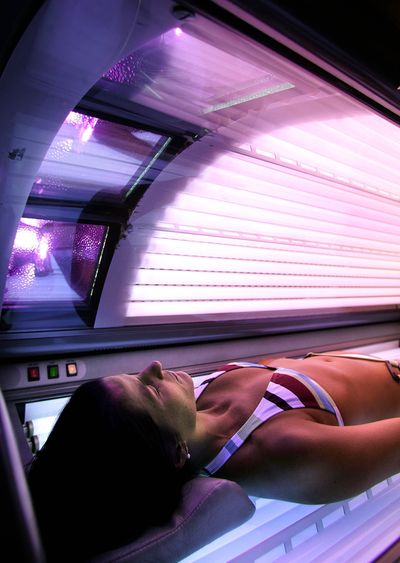 Glenda Fuster lies in a tanning booth at Run to the Sun tanning salon in Anchorage, Alaska. to  (File Associated Press / The Spokesman-Review)