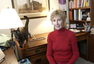 
Patty Harrison and her cat, Dory, pose in her  home office. Harrison runs Grammar Pro, a business specializing in training professionals to communicate more effectively.
 (JOE BARENTINE / The Spokesman-Review)