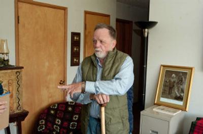  Alfred Hayward stands in the living room of his home in Wishram, Wash., and talks about losing his father. 