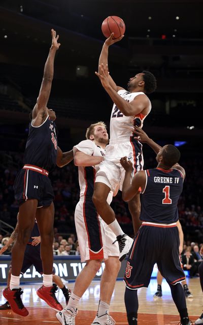 Gonzaga’s Byron Wesley (22) shoots over St. John’s Chris Obekpa, left, Phil Greene IV, and GU’s Przemek Karnowski. (Associated Press)