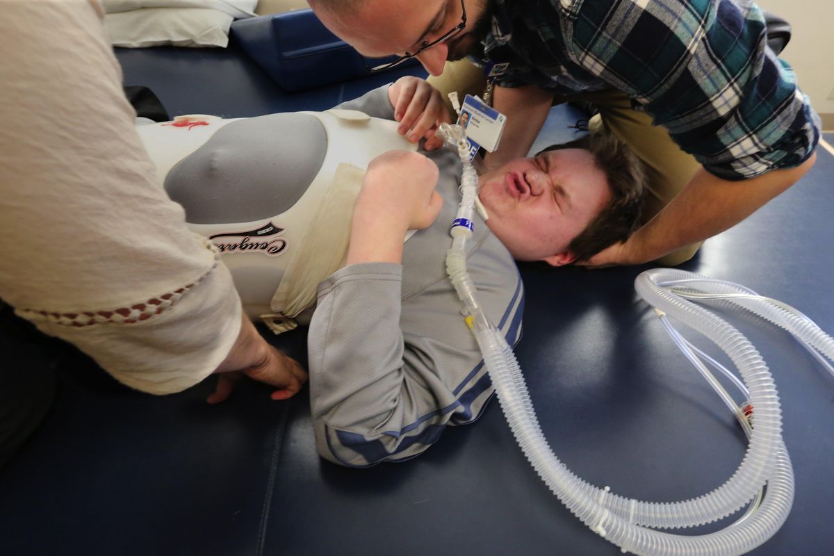 Hayden Werdal, 15, has physical therapy sessions in Silverdale, Wash., on Nov. 3, 2016. (Alan Berner / Seattle Times)