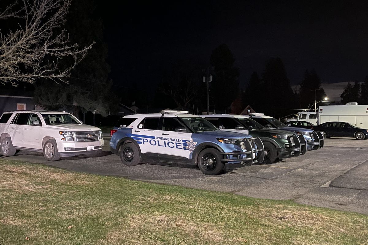 Several law enforcement vehicles were parked outside Deer Park City Hall Friday, April 5, 2024, after a deputy-involved shooting that left a man dead at a residence outside the city.  (Garrett Cabeza/THE SPOKESMAN-REVIEW)