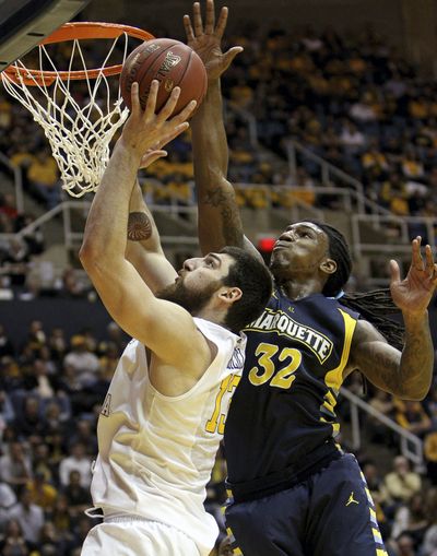 Marquette's Jae Crowder (32) blocks Deniz Kilicli’s shot. (Associated Press)