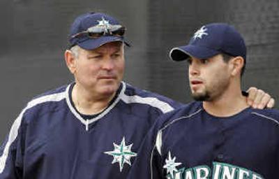 
New Mariners manager Mike Hargrove, left, throws an arm around pitcher Joel Pineiro at spring training.
 (Associated Press / The Spokesman-Review)