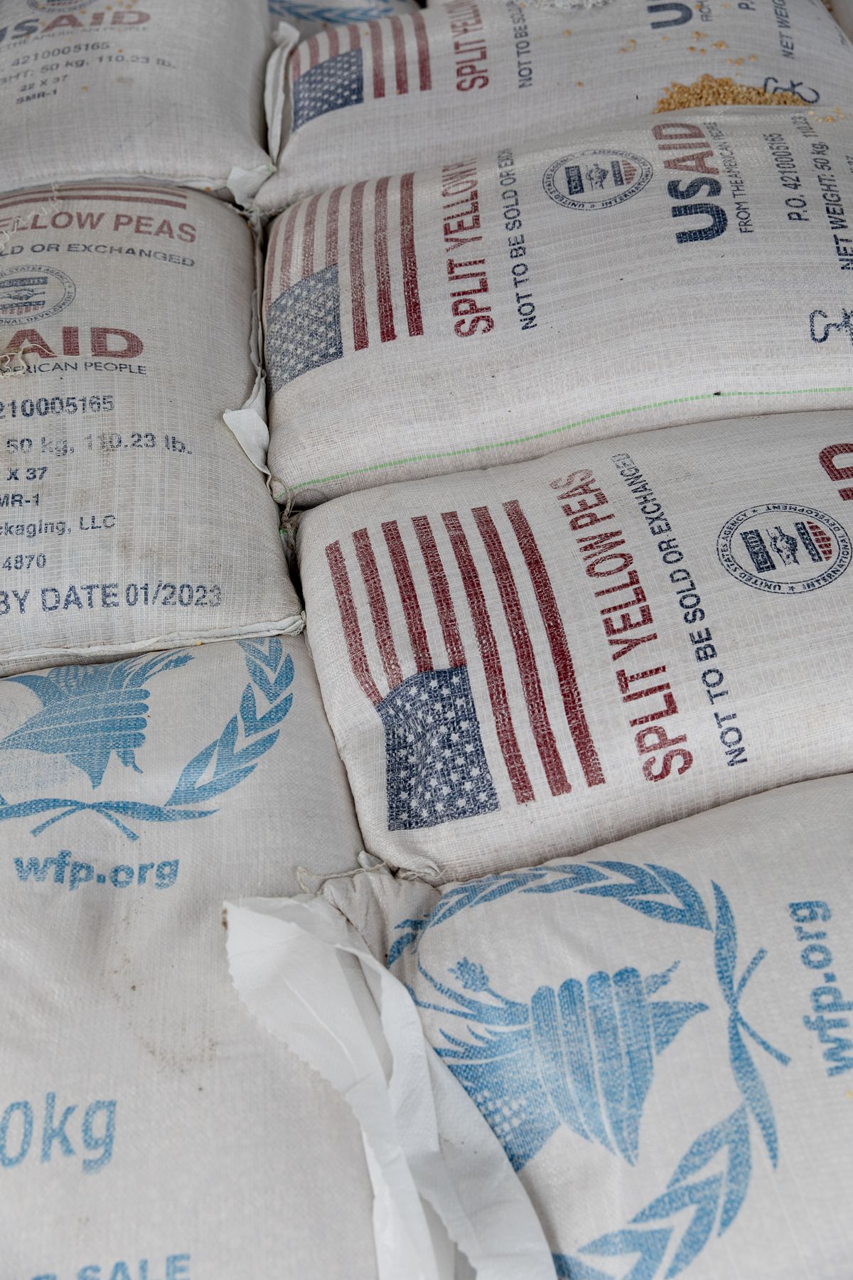 Yellow peas are piled up to be distributed in Bentiu, South Sudan, in 2021. (MUST CREDIT: Adrienne Surprenant/Item Collective for The Washington Post) (Adrienne Surprenant/Item/FTWP)