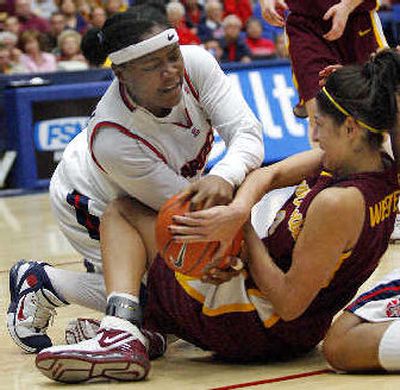 
Arizona State's Emily Westerberg, right, struggles with Arizona's Amina Njonkou for control of the ball during the second half.
 (Associated Press / The Spokesman-Review)