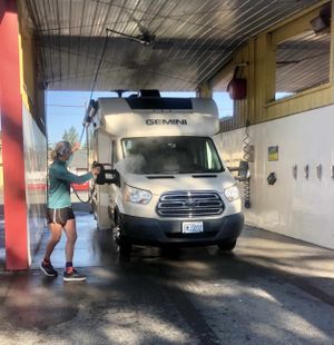 The Going Mobile team is ramping up for a six-month road trip and that includes washing a very dirty RV. (Leslie Kelly)