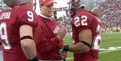 Paul Wulff chats with Chantz Staden, a top recruit from last year. (Christopher Anderson / The Spokesman-Review)