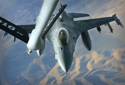 A United States F-16 prepares to take on fuel from a KC-135 refueling plane during the international war games Tuesday above Mountain Home Air Force Base in Mountain Home, Idaho. 
 (Associated Press / The Spokesman-Review)